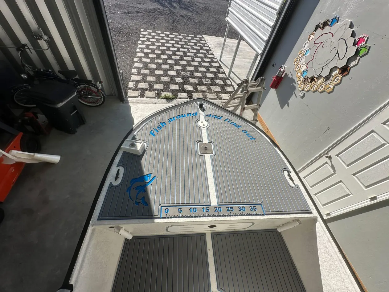 Casting deck mat with ruler and fish inlay